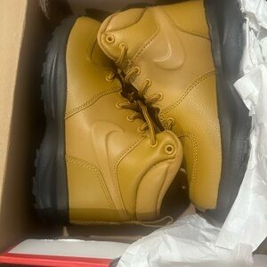 Never worn Nike boots good for school